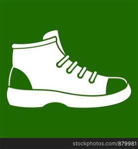 Tourist shoe icon white isolated on green background. Vector illustration. Tourist shoe icon green