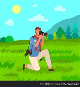 Tourist with photo camera, man photographer sitting on one knee and making scenic pictures of nature, green grass and trees, mountains and sun, outdoors landscape. Tourist with Photo Camera, Man Photographer Nature