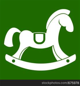 Toy horse icon white isolated on green background. Vector illustration. Toy horse icon green