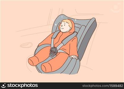 Transportation, safety, childhood concept. Young hapy smiling child kid boy infant toddler cartoon character sitting in special baby car seat in automobile. Children security in transport vehicle.. Transportation, safety, childhood concept