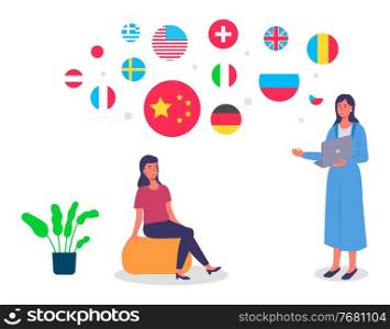 Travel agent woman standing with laptop in office and tells the girl client about countries. International business or training. The girl is sitting on a puff, fragments of flags of different states. Travel agent woman standing with laptop in the office and tells the girl client about the countries