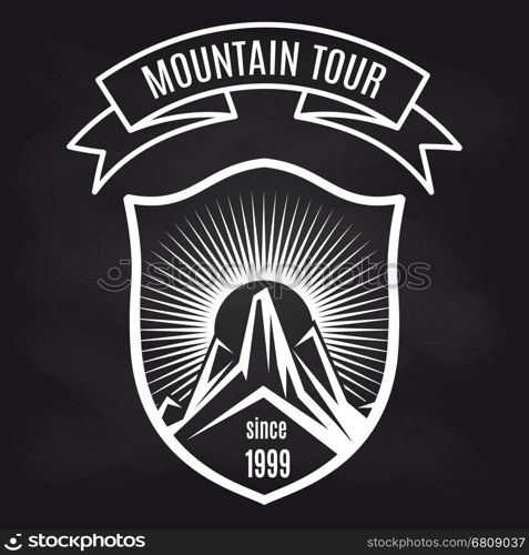 Travel label with mountain on blackboard. Travel label design vector illustration. Mountain tour retro badge on blackboard