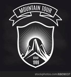 Travel label with mountain on blackboard. Travel label design vector illustration. Mountain tour retro badge on blackboard