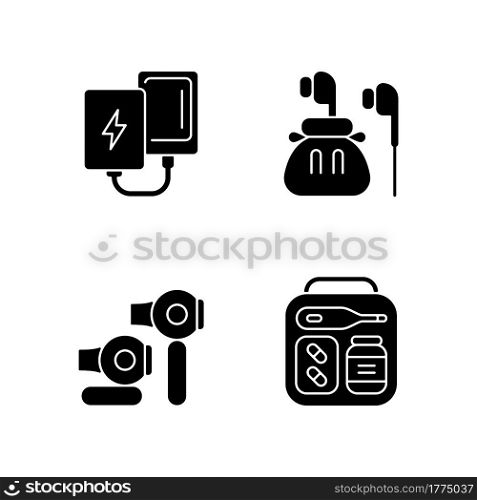 Traveller luggage black glyph icons set on white space. Compact powerbank and headphones. First aid kit. Mini size objects for tourist comfort. Silhouette symbols. Vector isolated illustration. Traveller luggage black glyph icons set on white space