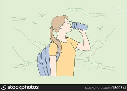 Travelling, tourism, nature, hiking concept. Young thirsty woman hiker tourist with backpack standing in mountain valley and drinking water. Vacation trip with active recreation and extreme lifestyle.. Travelling, tourism, nature, hiking concept.