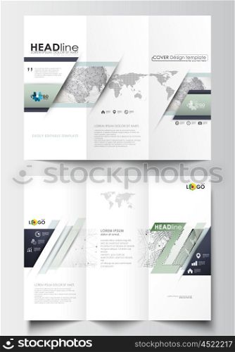 Tri-fold brochure business templates on both sides. Easy editable abstract layout in flat design. Dotted world globe with construction and polygonal molecules on gray background, vector illustration
