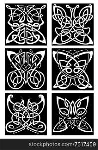 Tribal butterflies symbols for tattoo or t-shirt print design with infinity swirling celtic knot patterns arranged into beautiful butterflies with open wings. Tribal tattoos with celtic ornamental butterflies