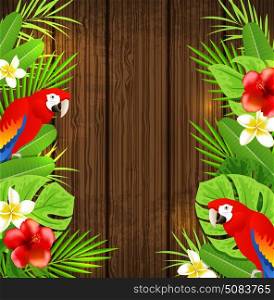 Tropical flowers, green palm leaves and red parrots on a wooden background