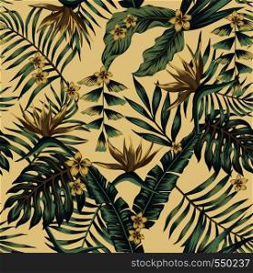 Tropical leaves and gold flowers seamless cheerful pattern wallpaper of palm trees and bird of paradise (strelitzia) plumeria on a beige background