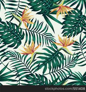 Tropical palm, monstera, fern leaves blue tone and bird of paradise flowers on the white background. Seamless vector pattern