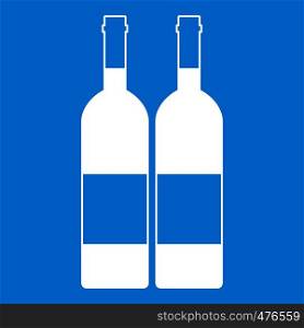 Two bottles of wine icon white isolated on blue background vector illustration. Two bottles of wine icon white