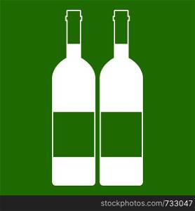 Two bottles of wine icon white isolated on green background. Vector illustration. Two bottles of wine icon green