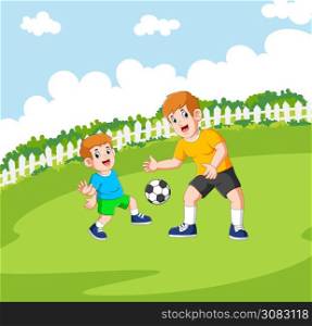 Two boys are playing the football