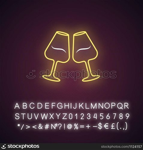 Two clinking wine glasses yellow neon light icon. Glassfuls of alcohol beverage. Wine service. Glassware. Cheers. Glowing sign with alphabet, numbers and symbols. Vector isolated illustration