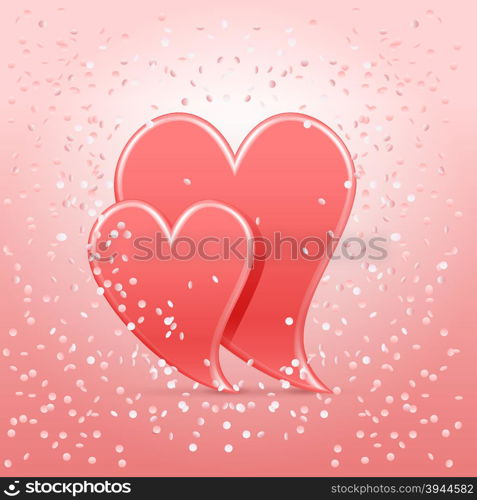 Two coral hearts with confetti falling over them in background