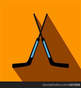 Two crossed hockey sticks flat icon. Goalkeeper sticks with shadow on a yellow background . Two crossed hockey sticks icon