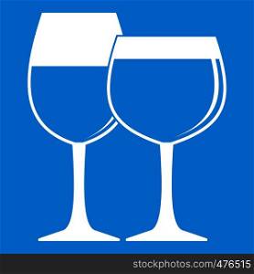 Two glasses of wine icon white isolated on blue background vector illustration. Two glasses of wine icon white