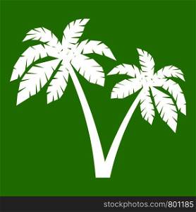 Two palms icon white isolated on green background. Vector illustration. Two palms icon green