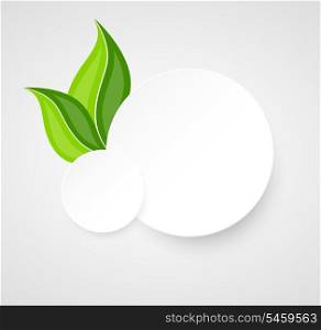 Two paper circles with leaves