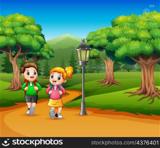 Two school children are walking on the road a forest