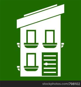 Two-storey house icon white isolated on green background. Vector illustration. Two-storey house icon green