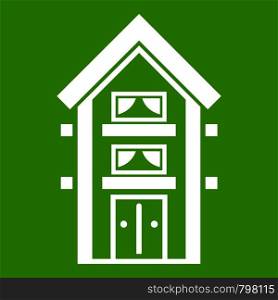 Two-storey house with balconies icon white isolated on green background. Vector illustration. Two-storey house with balconies icon green