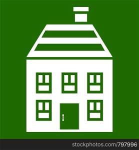 Two-storey house with chimney icon white isolated on green background. Vector illustration. Two-storey house with chimney icon green