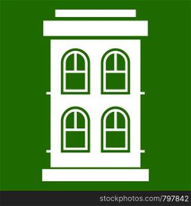 Two-storey house with large windows icon white isolated on green background. Vector illustration. Two-storey house with large windows icon green