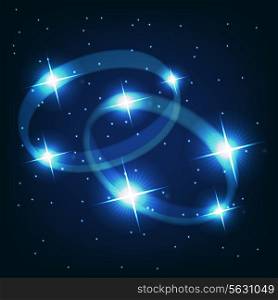 Two wedding rings beautiful bright stars on the background of cosmic sky