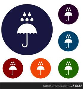 Umbrella and rain drops icons set in flat circle reb, blue and green color for web. Umbrella and rain drops icons set
