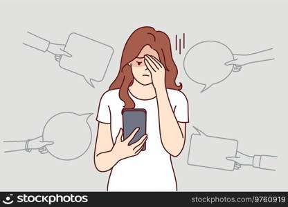 Upset woman with phone suffers from bullying and hate on social networks, receiving offensive messages and comments. Teenager girl is victim of internet bullying and discrimination from classmates. Upset woman with phone suffers from bullying and hate in internet, receiving offensive messages