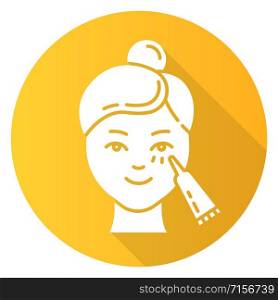 Using undereye cream yellow flat design long shadow glyph icon. Skin care procedure. Facial beauty treatment. Lifting and exfoliating effect. Eye makeup product. Vector silhouette illustration