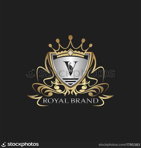 V Letter Gold Shield Logo. Elegant vector logo badge template with alphabet letter on shield frame ornate vector design.