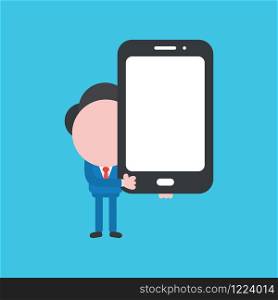 Vector cartoon illustration concept of faceless businessman mascot character holding smartphone on blue background.