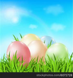 Vector Easter card with eggs and green grass