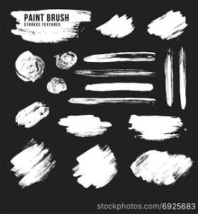 vector paint brush strokes texture. vector hand drawn various white monochrome paint brush strokes smears decorative dirty artistic realistic texture elements set isolated on black background