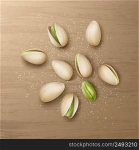 Vector realistic handful of whole and cracked pistachio nuts with salt top view isolated on wooden table. Handful of pistachio nuts