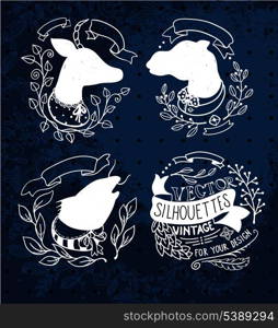 vector set of vintage floral frames with silhouettes of abstract animals