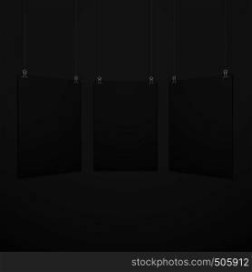 vector vertical black empty poster set suspended on office clamps mock up realistic shadow blank template isolated black background. vertical suspended poster set mockup