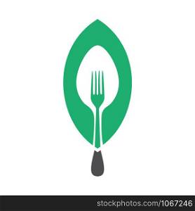 Vegan food logo concept. Fork and spoon with green leaf.