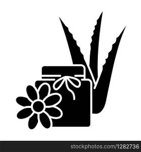 Vegan wax black glyph icon. Cream with floral extract. Organic lotion in jar with aloe vera. Medicinal herbs. Plant based cosmetic. Silhouette symbol on white space. Vector isolated illustration