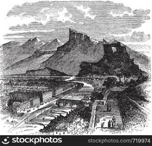 View of Grenoble, France vintage engraving. Old engraved illustration of buildings and mountains, 1890s.