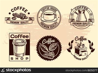 Vintage hand drawn hot drinks coffee logos with mug and beans. Isolated coffee shop vector labels. Coffee of cup labels for menu beverage illustration. Vintage hand drawn hot drinks coffee logos with mug and beans. Isolated coffee shop vector labels