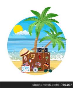 Vintage old travel suitcase on beach. Leather retro bag with stickers. Hat, photo camera, eyeglasses. Vacation travel. Vector illustration flat style. Vintage old travel suitcase on beach.