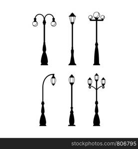 Vintage streetlights black silhouettes set. Vector retro street lamp lights isolated on white background. Vintage streetlights black silhouettes set