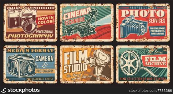 Vintage video and photo cameras rusty plates. Photography service and equipment shop, film studio vector tin signs with old medium format photo and retro cinema camera, movie projector, film reel. Cinema, photo vintage cameras vector rusty plates