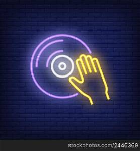 Vinyl disk with hand neon sign. Music, dj and sound concept. Advertisement design. Night bright neon sign, colorful billboard, light banner. Vector illustration in neon style.