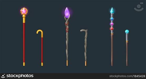 Walking sticks and magic staves for wizard or magician. Vector cartoon set of sorcerer wooden and golden sticks with shiny crystals isolated on dark background. Walking sticks and magic staves for wizard