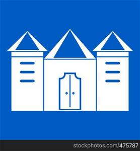 Wall and gate of the old fortress icon white isolated on blue background vector illustration. Wall and gate of the old fortress icon white
