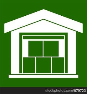 Warehouse building icon white isolated on green background. Vector illustration. Warehouse building icon green